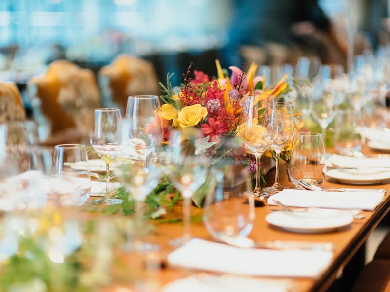 Beautifully set event table with floral centerpiece
